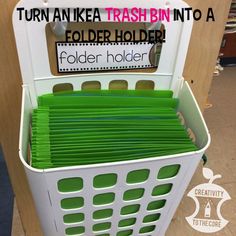 a white basket filled with green folders next to a sign that says turn an ike trash bin into a folder holder