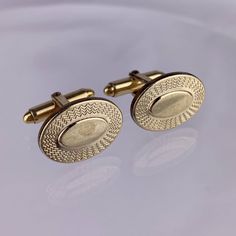 "Vintage Kreisler oval 14k yellow rolled gold overlay cufflinks. Measures approximately 1/2\" x 7/8\" long. Overall good condition. May have scuffs, scratches, and/or wear to the finish, corrosion spots, or other finish imperfections. See photos for more details." Antique Engraved Cufflinks For Formal Occasions, Antique Engraved Cufflinks For Formal Wear, Vintage Yellow Gold Cufflinks Gift, Classic Engraved Jewelry For Business, Formal Engraved Cufflinks, Vintage Engraved Jewelry For Business, Adjustable Gold Cufflinks For Business, Vintage Tarnish Resistant Jewelry For Formal Occasions, Vintage Tarnish-resistant Jewelry For Formal Occasions