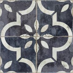 a black and white tiled floor with an artistic design