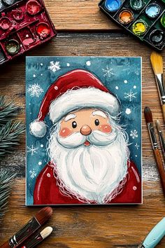 Hand-painted Christmas card of Santa with a jolly expression, surrounded by snowflakes.