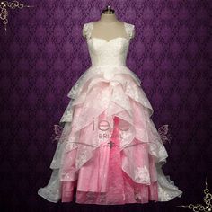 This Barbie Pink Ombre Lace Tiered Ball Gown Wedding Dress ERIS is the perfect choice for a unique and stunning wedding. The tiered lace skirt features a beautiful ombre effect in a vibrant Barbie pink color. Make a statement on your special day with this one-of-a-kind ball gown dress. Silhouette: Ball Gown Primary Fabric: Lace Style: Princess Closure: Corset Made to Order: 8 - 12 wks Rush Orders and Customizations: Contact Us Spider Oc, Barbie Pink Color, Pretty Gowns, Brides Maid Gown, Bride Maids, Hot Pink Weddings, Modest Neckline, Ball Gown Dress, Ombre Lace