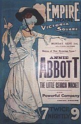 an advertisement for the empire theatre, featuring a woman in white dress and black hat