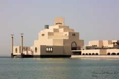 a large building sitting on top of a body of water