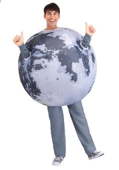 a man is holding an inflatable globe