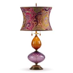 a lamp that is sitting on top of a wooden base with a purple and orange shade