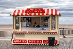 a small ice cream stand on the boardwalk