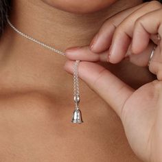 The bell charm is having a fashion moment right now in fashion press. This super sweet silver bell charm necklace, doesn't ring - don't let them hear you coming, we say!  All our charms attach with a clip-on clasp and are compatible with all other leading charm jewellery brands. Simply clip-on or slide-on to a chain, charm bracelet or charm carrier necklace.  All Lily Charmed jewellery comes presented in a beautiful gift box hand tied with ribbon. Material: Recycled 925 Sterling Silver.  At Lily Charmed, we strive to provide our customers with the highest quality jewellery. All our pieces are made from high quality 925 Sterling Silver and Gold-plated sterling silver and with proper care and maintenance it will last a lifetime.  To keep in perfect condition, use a silver polishing cloth reg Chain Charm Bracelet, Silver Bells, Box Hand, Recycled Sterling Silver, Super Sweet, Necklace Sizes, Beautiful Gift Boxes, High Quality Jewelry, Gold Plated Sterling Silver