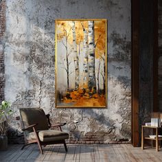 a chair sitting on top of a wooden floor next to a wall covered in paintings