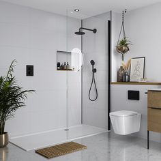 a bathroom with a toilet, sink and shower