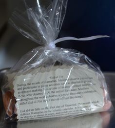 a bag of bread wrapped in plastic sitting on top of a counter