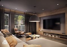 a living room filled with furniture and a large flat screen tv mounted on the wall