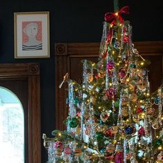 a decorated christmas tree with lights and ornaments