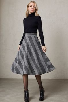 The skirt is very warm and cozy in wool, with a mid-length that hits just at mid-calf and an A-line fit as well as just the right amount of plaid. ★★ FEATURES * 30% wool, 30% fiber, 40% polyester * Polyester lining * Two side seam pockets * Right zipper closure * back little elastic band * Plus size full skirt * A Line Skirt * Perfect for Winter, autumn * Dry clean ★★ The model is 170 cm (5′ 7″) tall with a 80 cm (31.5") bust, 66 cm (26") waist. She is wearing the plaid wool skirt in size XS. ★★ Bespoke Order Service If you Request other color Request the length Your height is not between 155 cm- 172 cm Your weight is over 75 kg I can do it for you, It will need some extra fee depending on on your need. Contact with me for more detail. ★★ Get your size in Size Chart with your body measurem Chic A-line Winter Skirt, Casual A-line Winter Skirt, Chic Lined Winter Skirt, Casual Full Skirt For Winter, Winter Wool A-line Skirt, Chic Winter Relaxed Skirt, Chic Relaxed Winter Skirt, Winter Wool Pleated Skirt Bottoms, Chic Wool Skirt For Winter