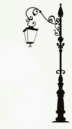 a black and white photo of a street light with an ornate design on the side