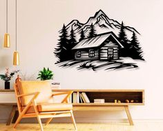 a living room with a chair and wall decal in the shape of a cabin