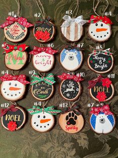 twelve decorated christmas cookies hanging on a wall