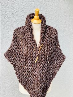 Hand knitted Outlander inspired shawl, scarf, shoulder wrap, neck warmer in marled brown with a hint of pale purple. - triangle design, can be worn in many different ways - one size fits all - made with 1 tassel, please let me know if you prefer 3 tassel (on each tip) or no tassels - super soft 50% acrylic, 30% wool, 20% mohair yarn - available in any color or yarn imaginable, please contact me for custom orders - made in smoke and pet free environment CARE: Hand wash , air dry. Brown Crochet Shawl For Fall, Fall Crochet Brown Shawl, Cozy Brown Shawl One Size, Handmade One-size Fall Wraps, Cozy One-size Brown Shawl, Brown Knitted Shawl For Fall, Cozy Crochet Shawl One Size, Brown Hand Knitted One Size Knitting Pattern, One Size Hand Knitted Brown Knitting Pattern