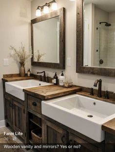 a bathroom with two sinks and mirrors in it