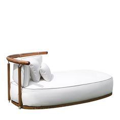 a white couch with wooden arms and pillows on it's back end, against a white background