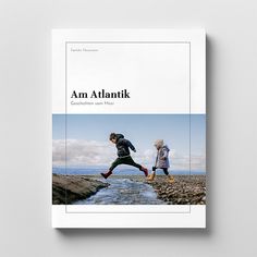 the book cover shows two people walking on rocks near a stream, and one man is jumping