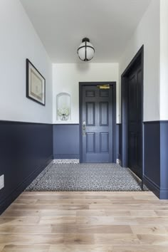 an image of a hallway with blue and white walls