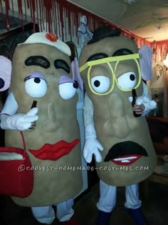 two people in costumes made to look like they are eating hotdogs and potatoes