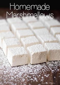 homemade marshmallows on a wooden table with text overlay that says homemade marshmallows