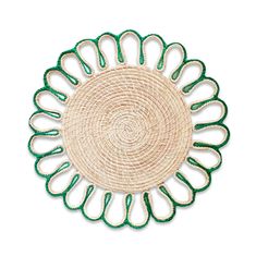 a green and white woven plate on a white background with an intricate design in the center