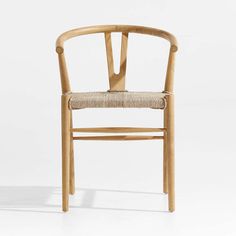 a wooden chair with a woven seat and backrest, viewed from the front on a white background