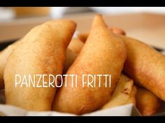 some food that is in a bowl on a table with the words panzerotti fritti above it