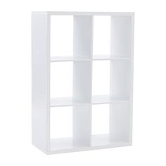 a white bookcase with four shelves on each side