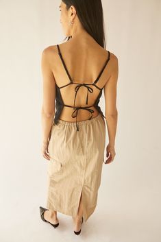 This linen blend tank top is made in a classic fit with a square neckline and an open back. The open back is detailed with back ties and the shoulder straps are adjustable. Style yours and wear it with matching linen blend pants for a full summer look.DETAILSLinen blend fabric. Square neckline. Adjustable shoulder straps. Open back with ties.FIT & SIZING Classic fit 12.25" length based on size S Model is 5'7" and is wearing a size S Open Back Tank Top, Vegan Leather Tote Bag, Open Back Tank, Oak And Fort, Vegan Leather Tote, Linen Blend Pants, Teal And Grey, Summer Look, Black Tank Tops