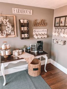 a coffee bar in the corner of a room with pictures on the wall above it