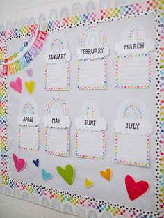 a bulletin board with hearts and rainbows on it