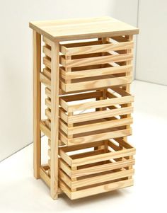 a stack of wooden crates sitting on top of a white table