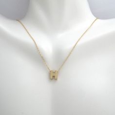 This pendant necklace is crafted in 14 Karat yellow gold. Featuring the letter "H" on a adjustable necklace measuring 16 or 18 inches in length. Modern Yellow Gold Initial Pendant Necklace, Burr Basket, H Initial, Letter H, Initial Necklace Gold, Initial Pendant Necklace, Letter Pendants, Initial Pendant, Basket Ideas