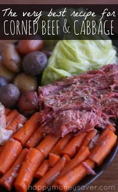 the very best recipe for corned beef and cabbage on a plate with carrots