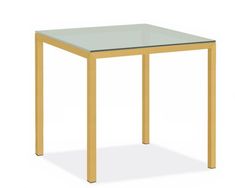 a table with a glass top and wooden legs on an isolated white background for display