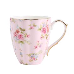 a pink floral coffee cup with gold rim