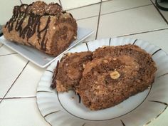 two pieces of cake on plates sitting on the floor