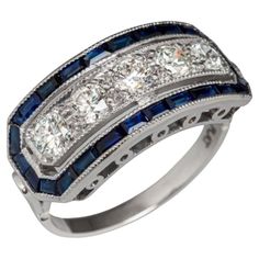 Original Antique Art-Deco Diamond Five Stone and Calibre Sapphire Ring 1920s Mounted and tested in Platinum. This ring is wonderly handmade with 5 Old European-cut Diamonds weighing approx. 0.65 carats and rectangular calibre sapphires approx. 0.45 carats. Measures Width 2.5cm X Length 0.8cm. Ring Size USA 7 (EU 54) Total weight 4.62 grams. Most rings can be sized up or down one size unless noted and sometimes can be sized more. We offer FREE insured international shipping with FedEx Internation Antique Cocktail Ring, Stone Diamond Ring, European Cut Diamonds, Art Deco Diamond, Natural Blue Sapphire, Antique Art Deco, Brilliant Diamond, Round Brilliant Cut Diamond, Antique Art