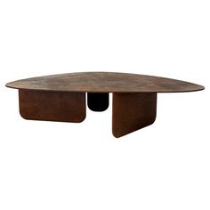 an oval shaped table with two legs and a circular top, made out of wood