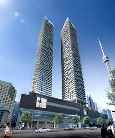 an artist's rendering of two tall buildings in the city