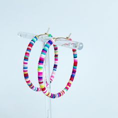 These Sprinkle hoop Heishi earrings are so much fun! Lightweight with a dainty pop of color - you'll want to wear these all the time!  The Sprinkle earrings are made from 3mm rainbow Heishi disc beads, and they're hand-beaded on gold-filled hoops!  - 40mm (about 2 inches in diameter)  🎉The matching Confetti bracelets are available here in singles or stacks! ---> https://etsy.me/32ioICk 🌟View all of Southern Kate's earrings here --->https://etsy.me/3ahOB9T Playful Multicolor Hoop Jewelry, Fun Multicolor Dangle Hoop Earrings, Colorful Beaded Hoop Earrings For Beach, Multicolor Beaded Hoop Earrings For Beach, Small Multicolor Hypoallergenic Hoop Earrings, Colorful Small Hoop Earrings With Ear Wire, Fun Adjustable Nickel-free Hoop Earrings, Adjustable Fun Hoop Earrings Nickel Free, Adjustable Fun Nickel-free Hoop Earrings