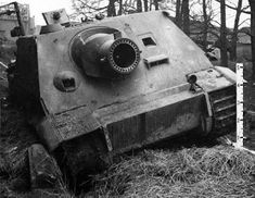 an old tank that is sitting in the grass