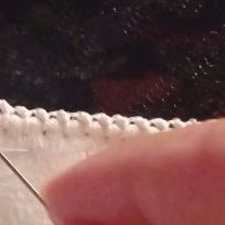 the needle is being used to sew fabric