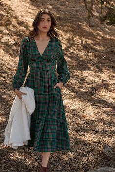 Enter fall season with great looks, including the Jace Plaid Shely Button Down Midi Dress. Long sleeves with elastic cuffs, frame a v neckline with a button-down placket all the way down to the midi length. This tiered dress will look extra cute with short boots or heels. - Plaid- Midi- Balloon long sleeves- Tiered- Color: Green MultiSize + Fit - Model is 5'9" and wearing size XS- Measurements taken from size S - Chest: 17"- Length: 49" Fabric Self: 100% Cotton, Lining: 97% Polyester 3% Spandex Green Plaid Dress, Button Down Midi Dress, Thanksgiving Fashion, Flannel Dress, Bra Dress, Dress Long Sleeves, Body Dress, Green Midi Dress, Versatile Dresses