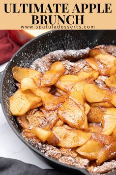 an apple pie in a cast iron skillet with powdered sugar on top and text overlay