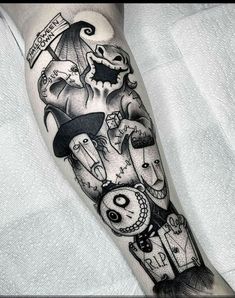 a black and white photo of a leg with some tattoos on it