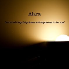 a light that is sitting on top of a table next to a wall with the words alla